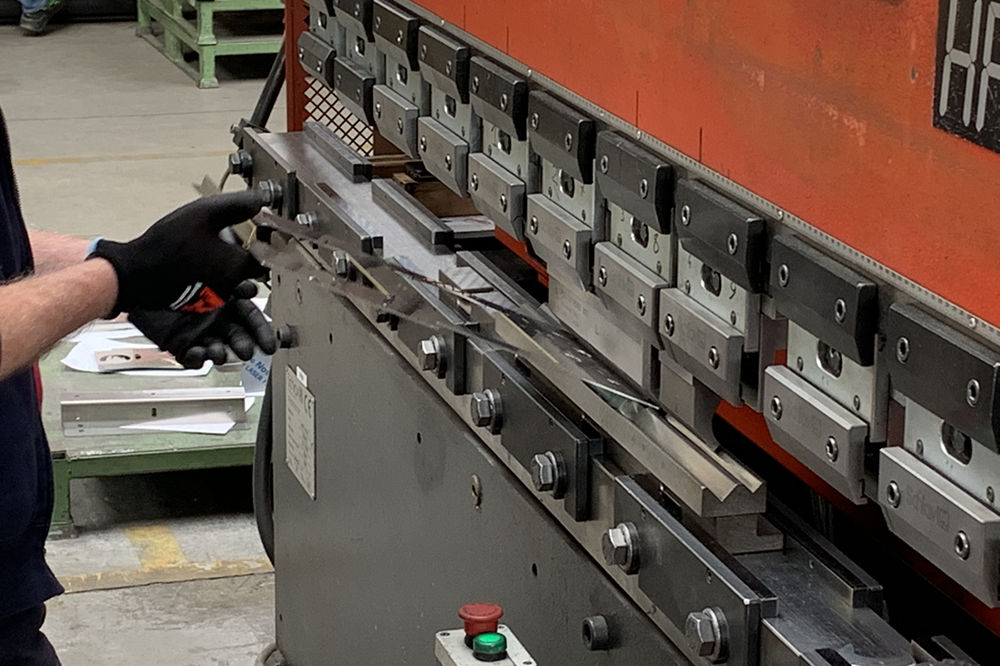 Master Artisan making espresso machine parts in Italy by Bezzera, cafe coffee machine